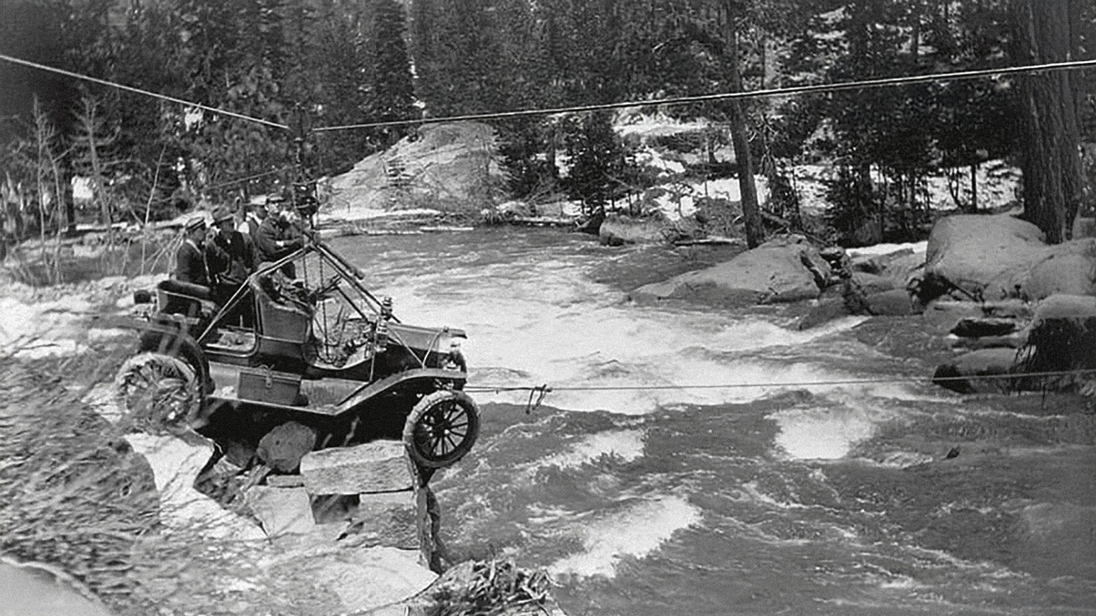 The 1911 Silver Cup run — Arthur Foote’s 1911 Ford Model T cabled across the rapids at the washed-out Yuba bridge